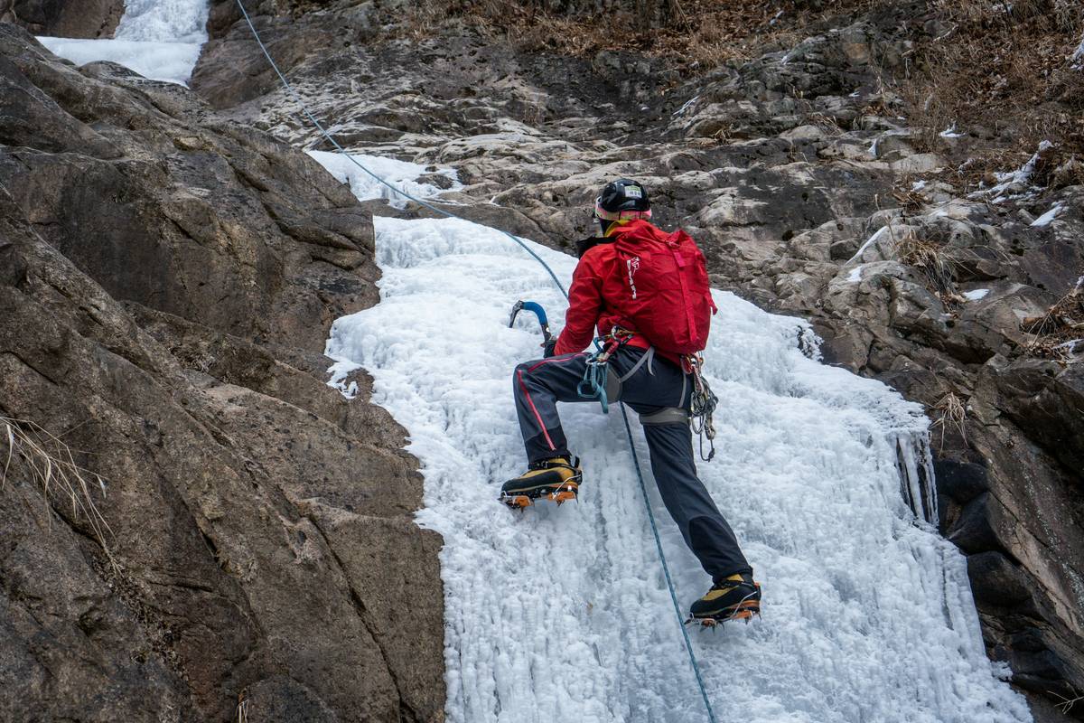 Close-up of bent ice piton showing deformation after high ice piton failure rate incident